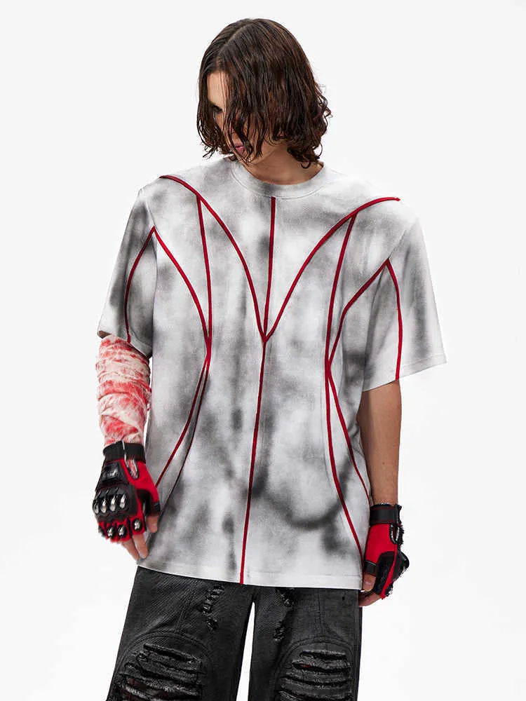 Padded shoulder T-shirt with textured line patchwork design on front