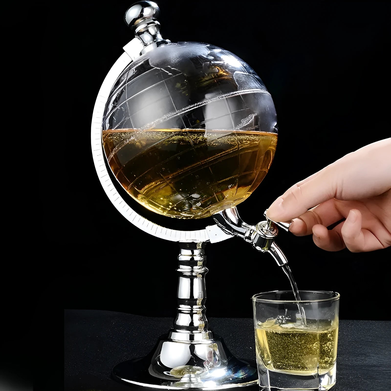 Transparent globe wine decanter dispenser with silver chrome stand and plastic body on a table