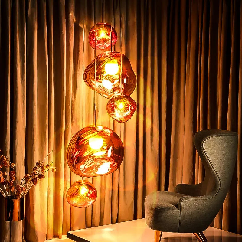 Irregular shaped glass LED chandelier in a metallic finish, showing Nordic post-modern design.