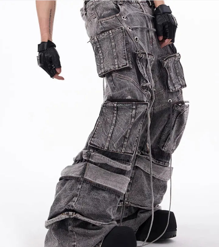Grey cotton denim distressed overalls with rope stitching in mop pant style on model