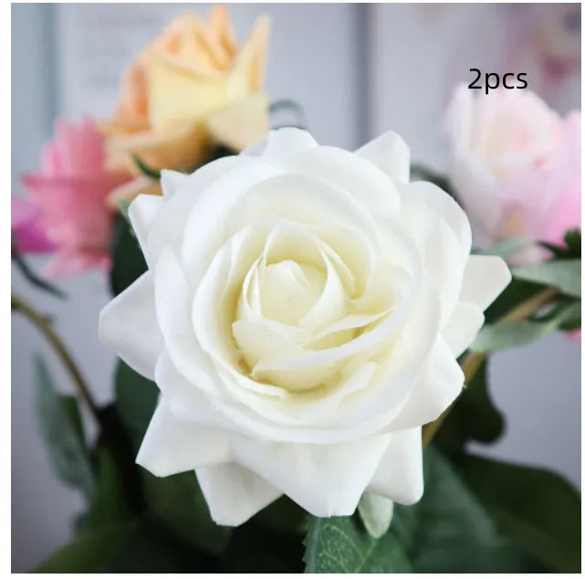 Artificial silk flower bouquet with red petals and green leaves measuring 42cm long