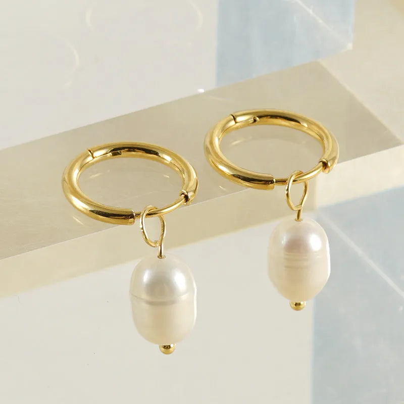 Gold geometric stainless steel earrings with pearl decorative elements