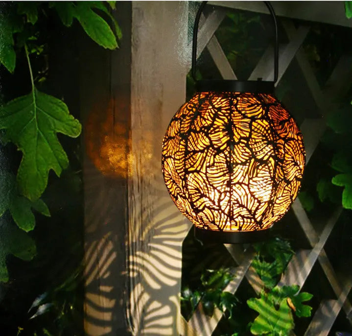 Solar outdoor courtyard hollow decorative iron portable lamp with warm white LED light