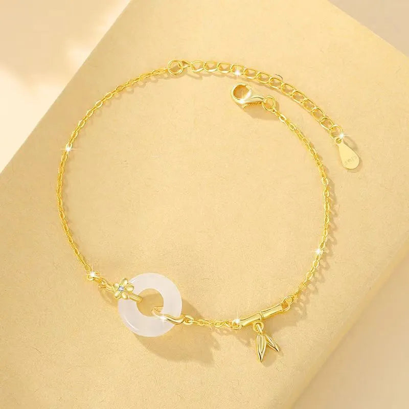 Silver white chalcedony bracelet with starry sky design and peace buckle on a neutral background