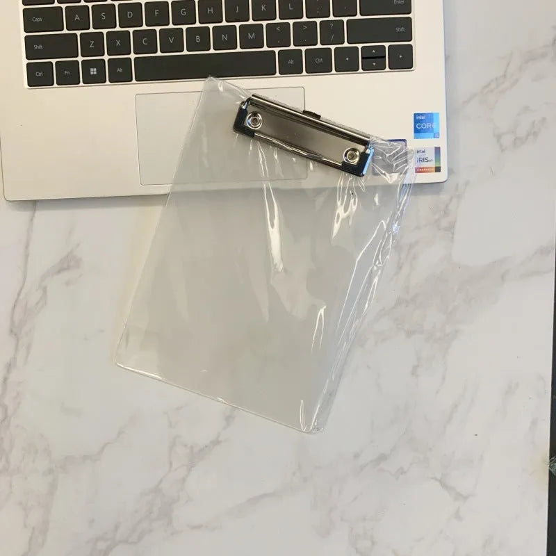 Transparent plastic A4 plate holder with metal clip and integrated writing board surface, shown in blue.
