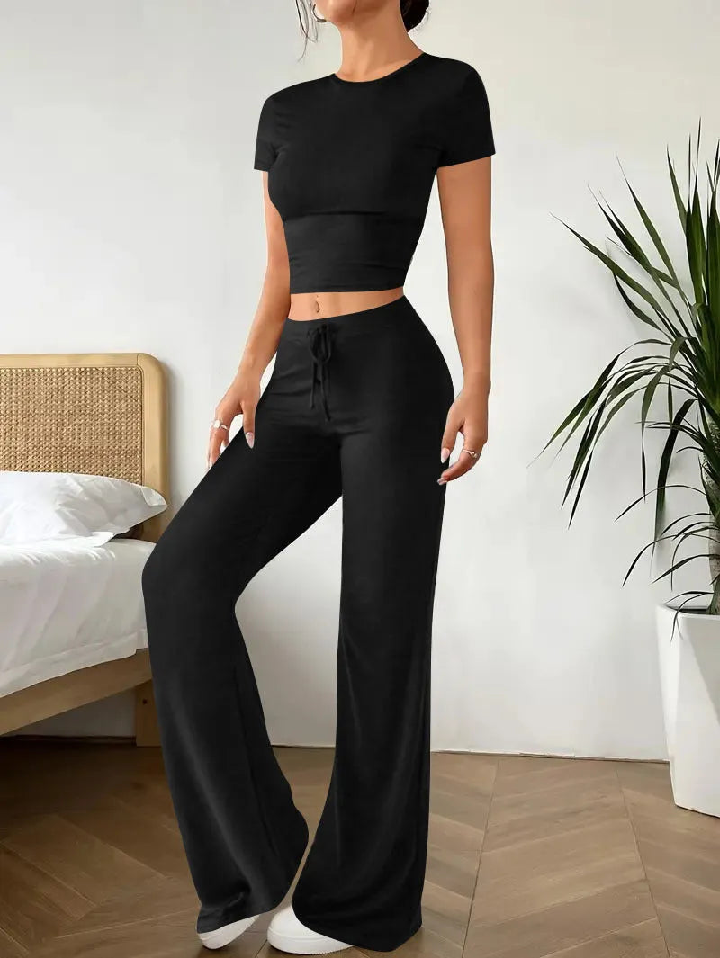 Women's black high-waist trouser and short-sleeve t-shirt suit set on hanger