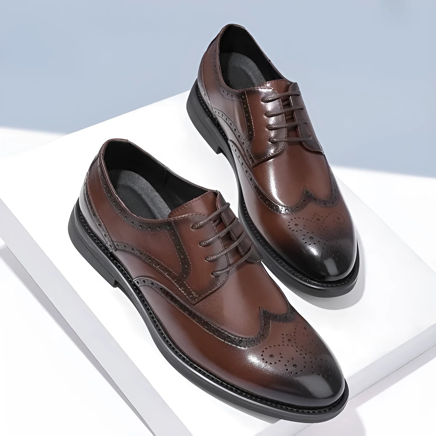 Men's black brogue leather shoes with traditional perforated toe design on business styling