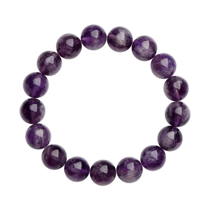 Natural purple feather amethyst crystal bracelet with scattered beads and geometric Ruyi pattern on a wrist.
