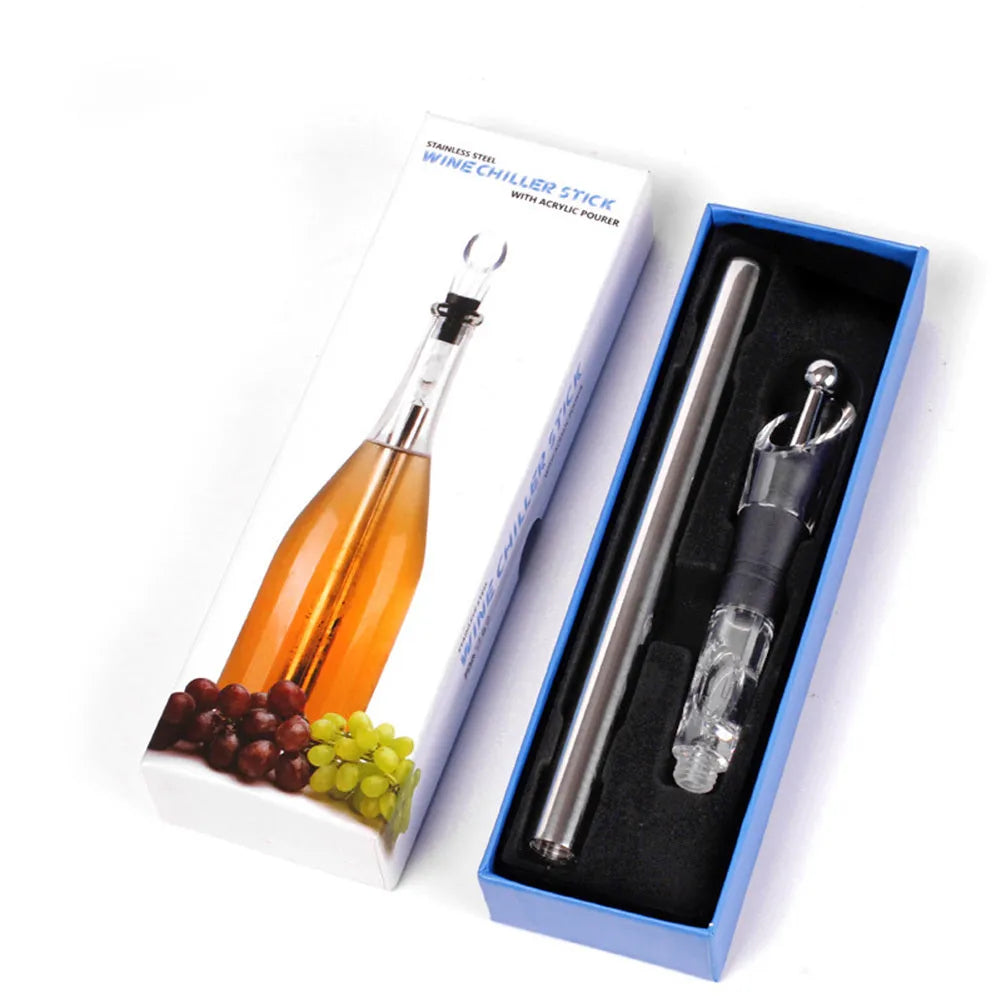 Silver stainless steel wine bottle cooler stick with built-in aerator and drip-free pouring nozzle on a table