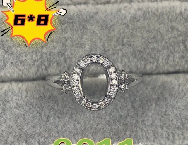 Oval denier copper ring with 6x8mm stone and star design on an open mouth band.