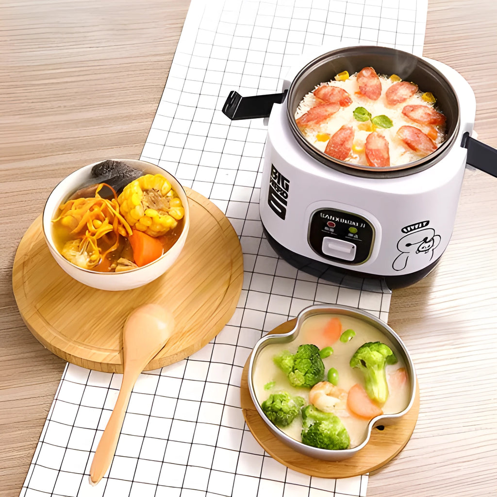Compact blue mini rice cooker with steaming tray on kitchen counter