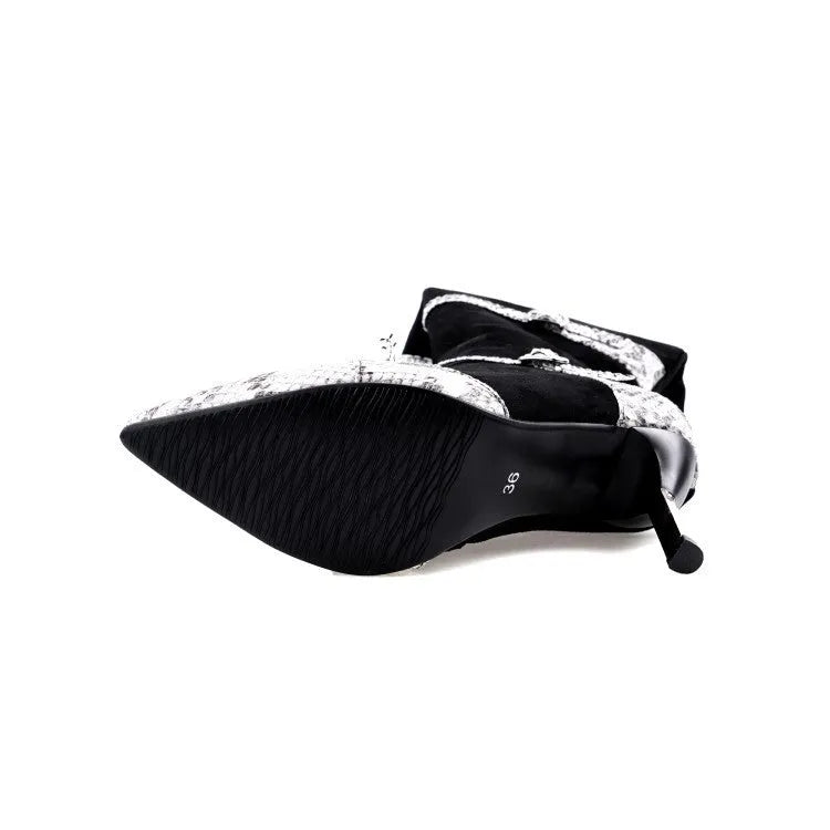 Women's grey knee-high boots with stiletto heels showing shaft height and PU leather texture