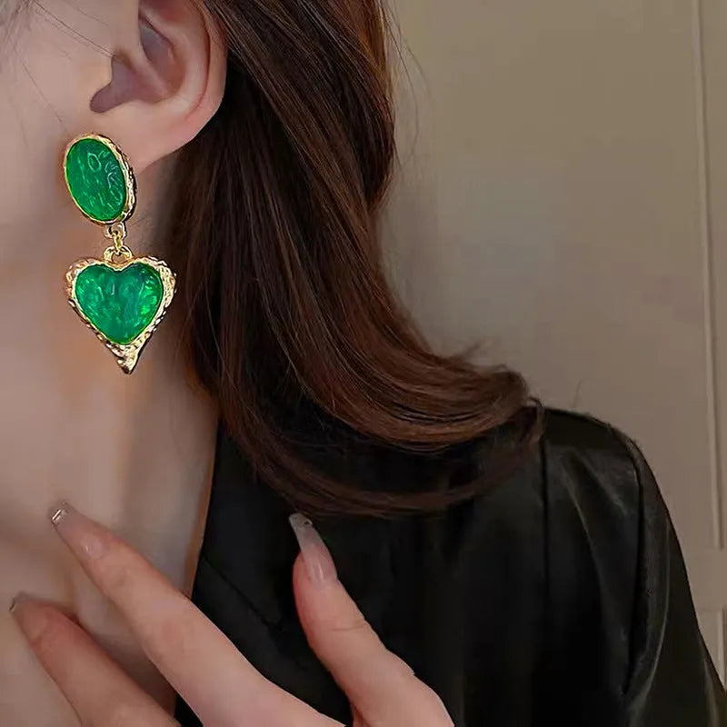 Oval love heart stud earrings with pleated texture in purple, red, green, and yellow-white colours