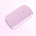 White ultraviolet disinfection box with wireless charging pad for mobile phones and nail tools.