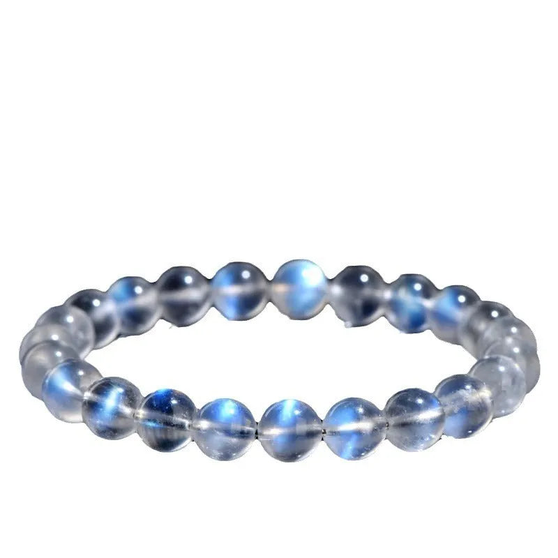 Natural cream body crystal blue moonlight bracelet showing polished finish on a simple band.