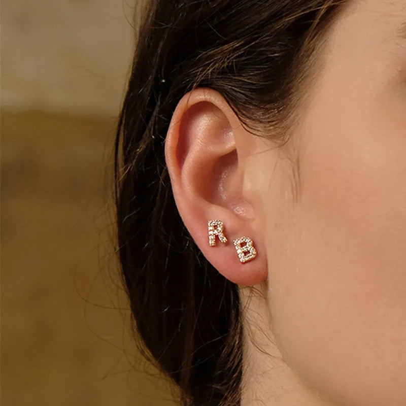 Brass gold plated alphabet letter earrings showing A to Z range on copper with zircon details