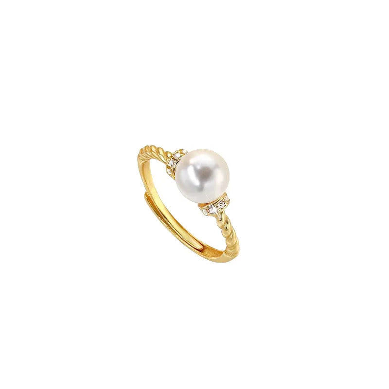 Adjustable antique-style copper ring with a geometric shape and an inlaid pearl, shown in gold and silver colour options.