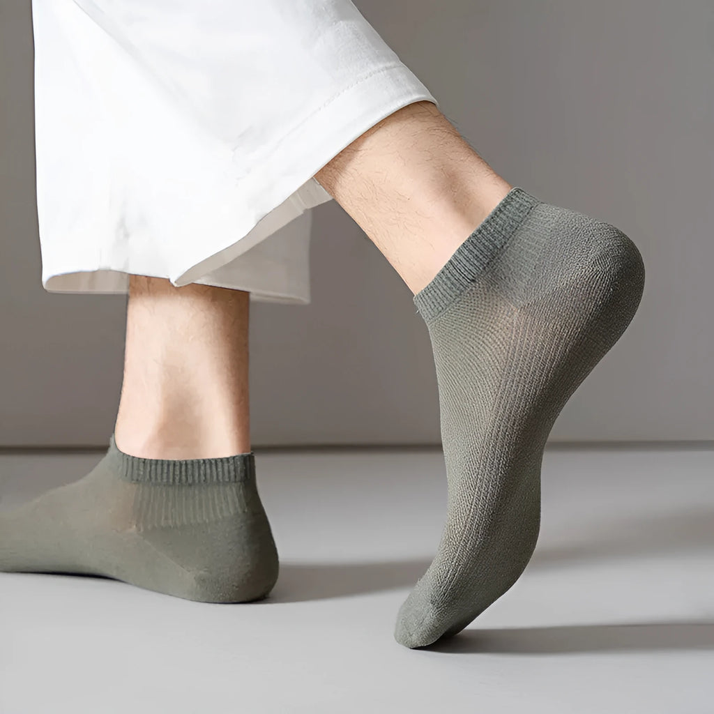 Solid colour low-cut polyester boat socks for men displayed in multiple colour options.