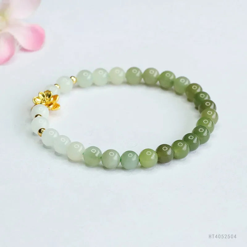 Hand-woven Hetian jade bracelet with a clear water gradient and national style floral design.