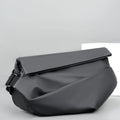Grey PU leather crossbody bag showing internal phone and document compartments with zip opening