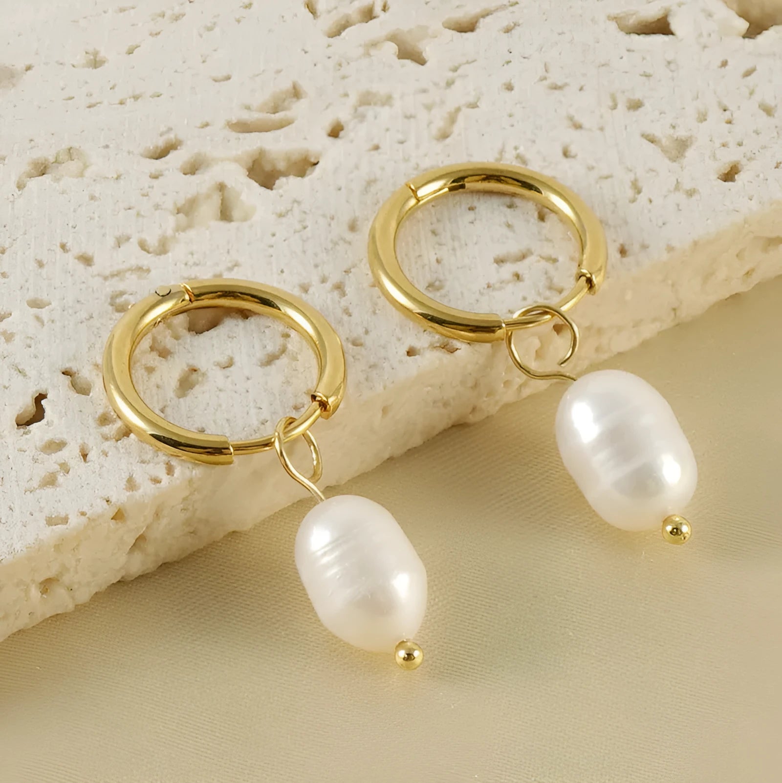 Gold geometric stainless steel earrings with pearl decorative elements