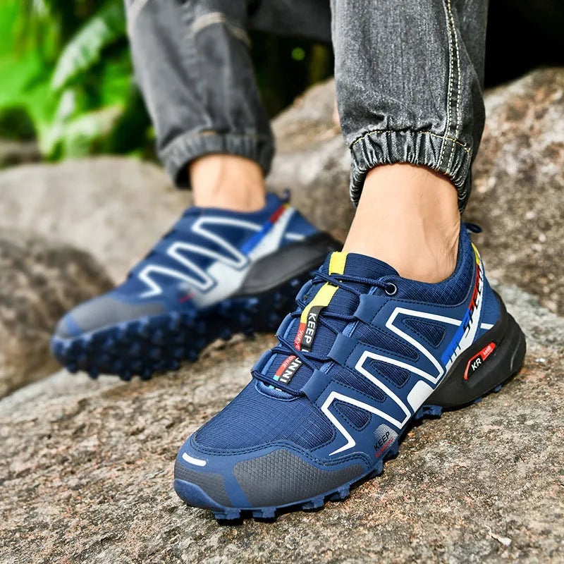 Men's plus size low-top casual running shoes in grey orange colour with synthetic leather upper and rubber sole.