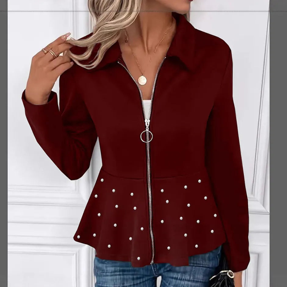Women's loose black coat with beaded heavy-duty zipper and ruffled hem, shown on a hanger.