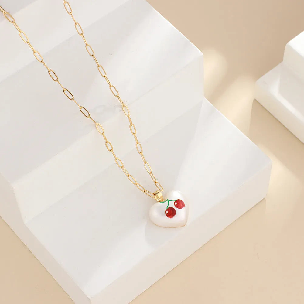 Heart-shaped fruit pendant necklace with strawberry design on adjustable metal chain
