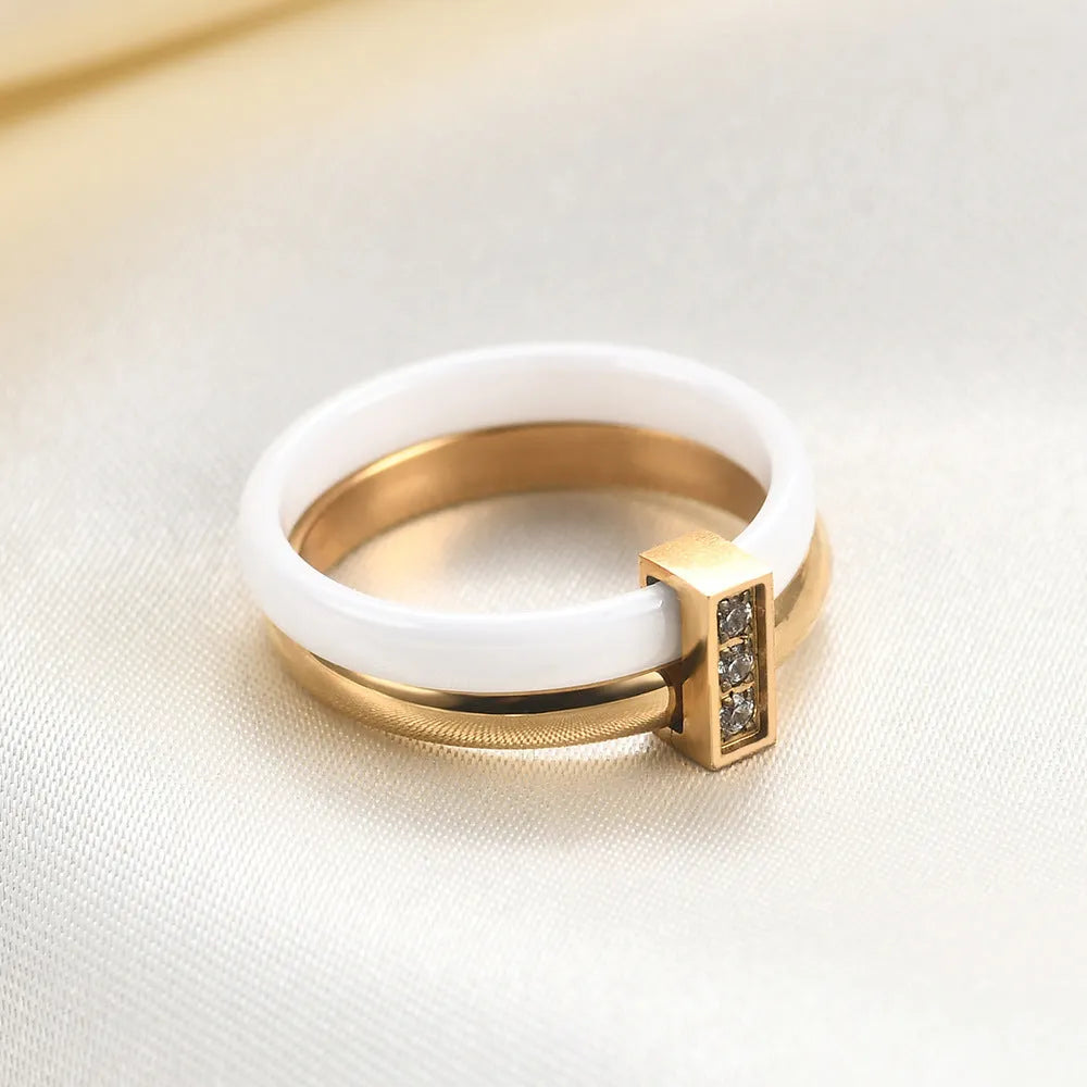 Geometric zirconium ceramic women's ring with glossy stitching in steel black or gold white finish