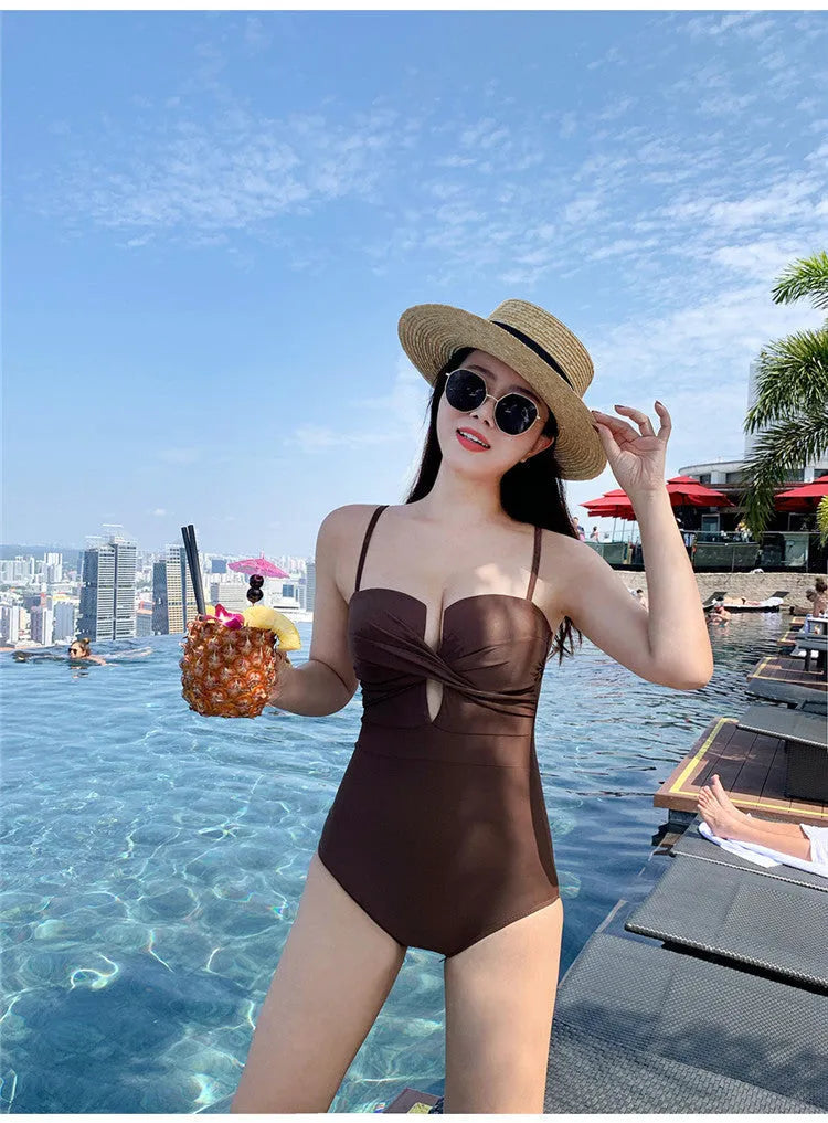 Solid colour small chest push-up spaghetti strap one-piece swimsuit in white, pink, and brown