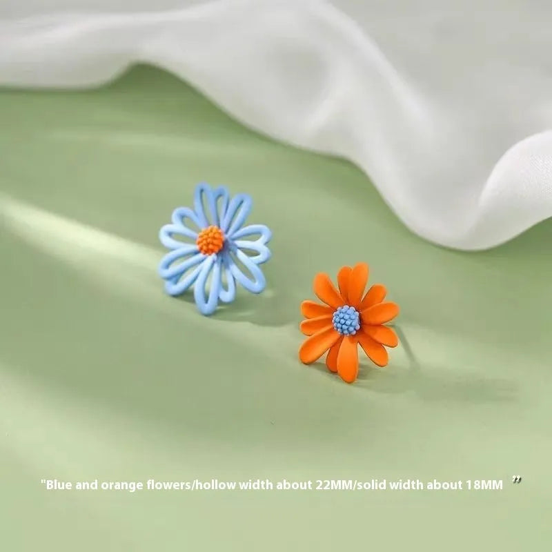 Alloy flower stud earrings in three two-tone colour combinations: white and green, yellow and white, blue and orange