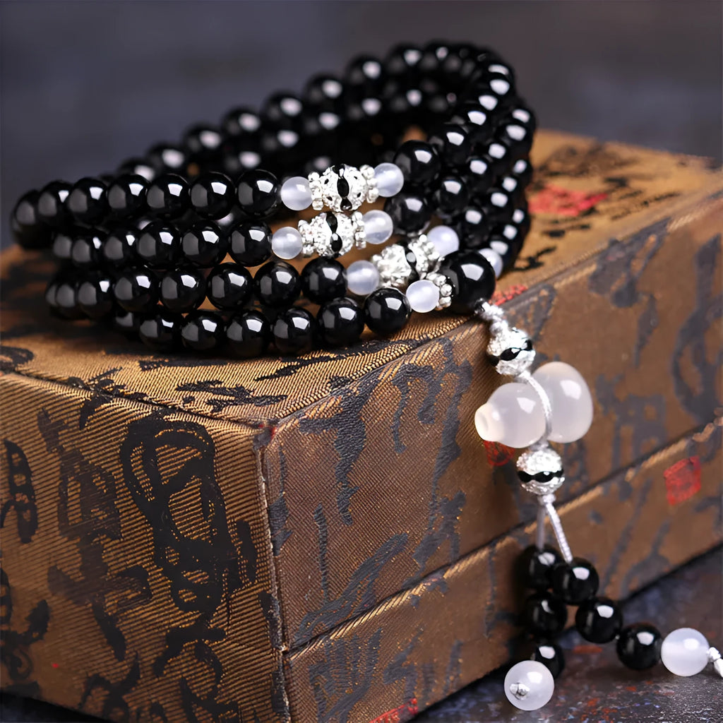 Natural black agate 108 beads bracelet on a flat surface, geometric beads, unisex fashion OL style