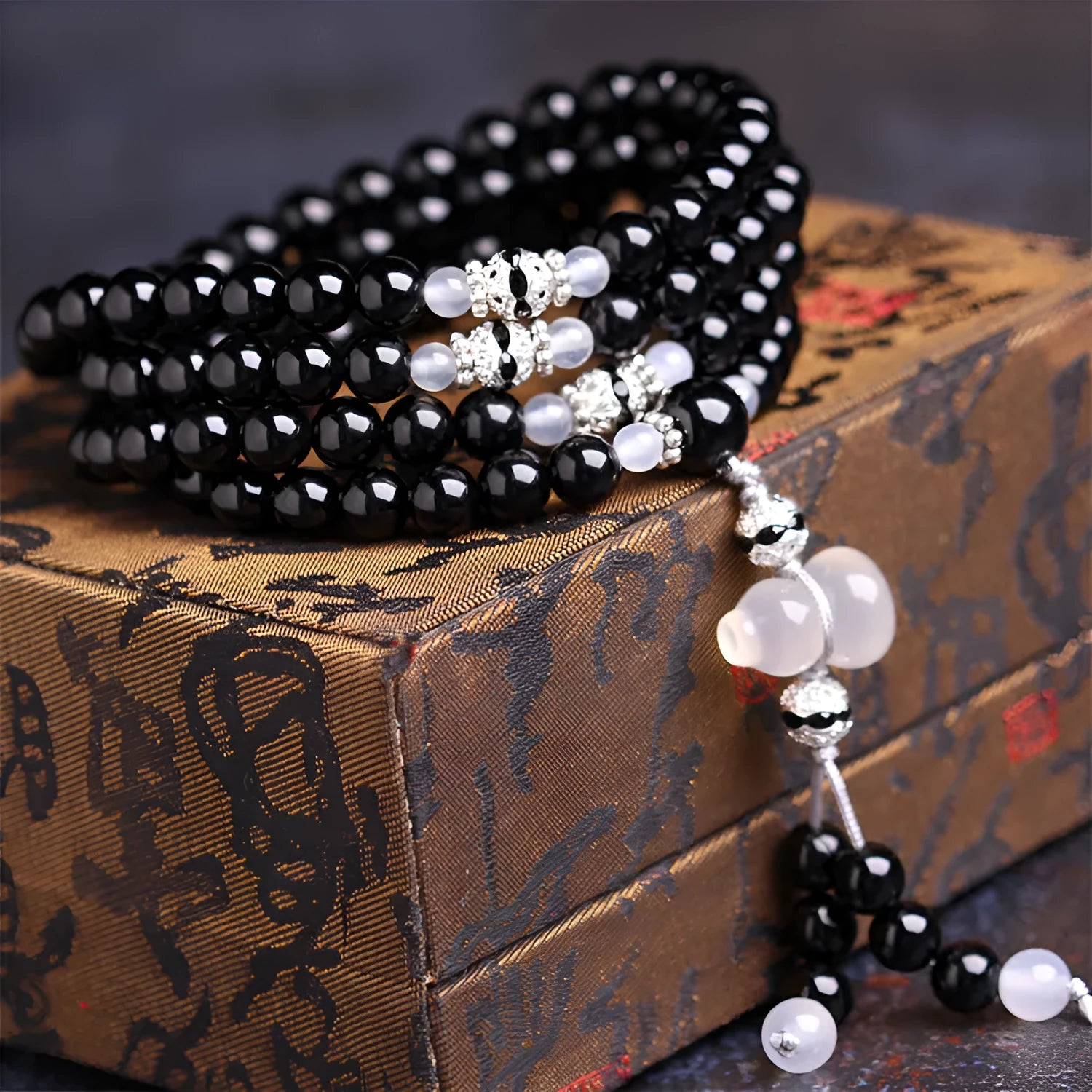 Natural black agate 108 beads bracelet on a flat surface, geometric beads, unisex fashion OL style