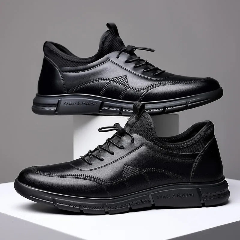 Men's black casual leather loafers with round toe, square heel, and slip-on design on a neutral background
