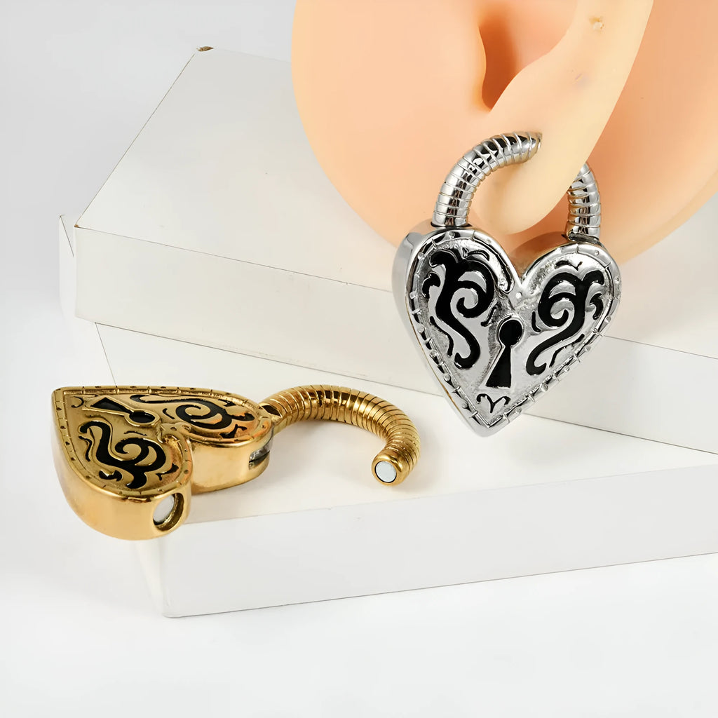 Close-up of a women's stainless steel heart-shaped earring with an electroplated gold colour finish.