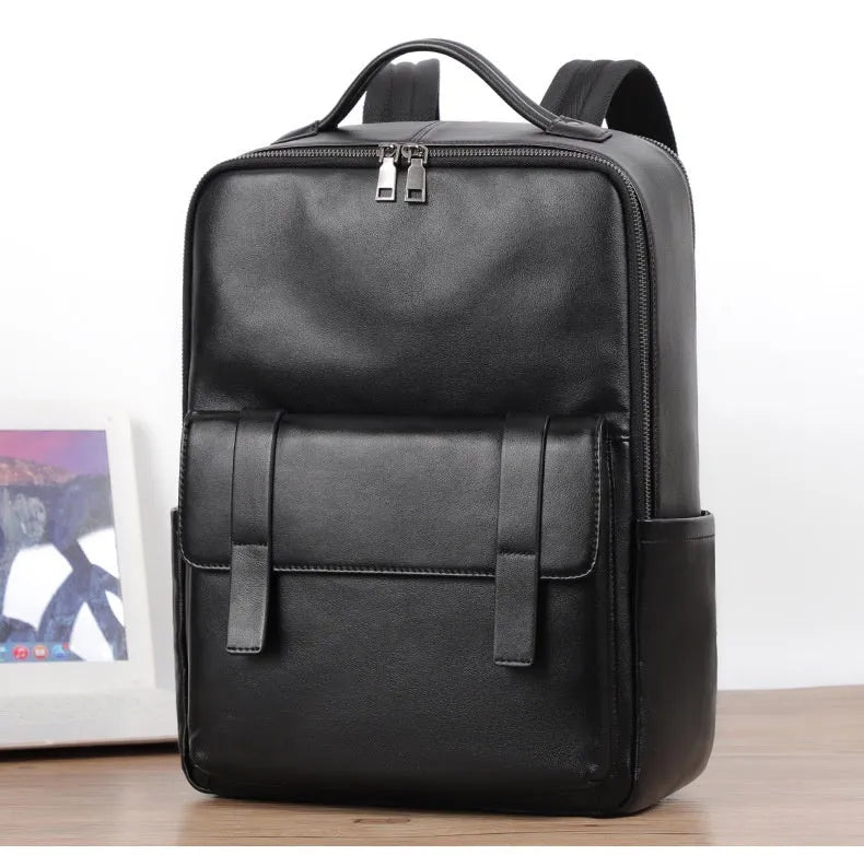 Men's black genuine leather laptop backpack with woven detail and large 36-55L capacity.
