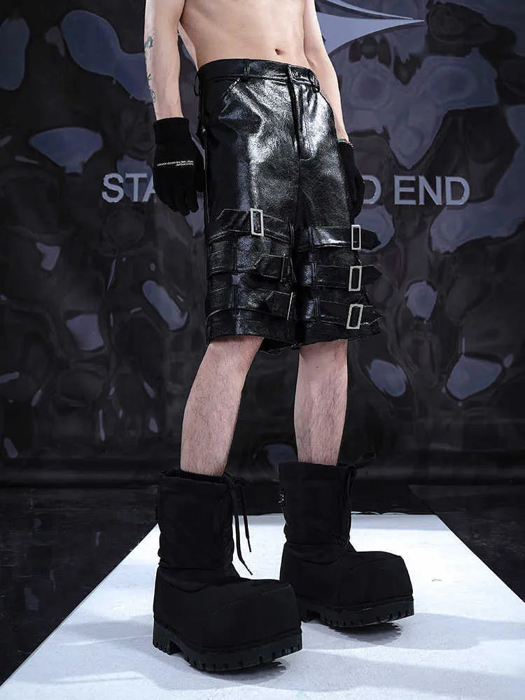 Black men's leather shorts with ring detail and cropped design