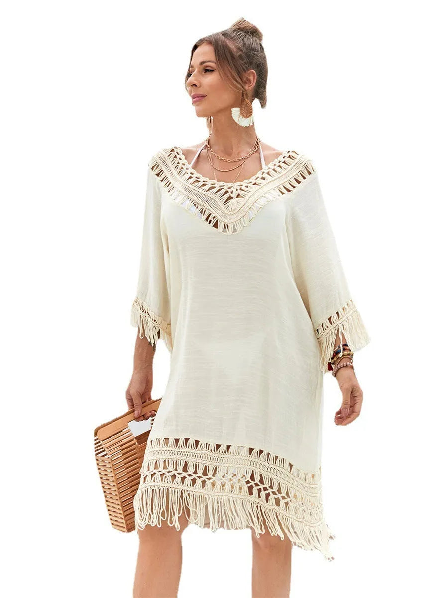 Hand-crocheted apricot-coloured beach dress with a lining, shown as a women's cover-up.