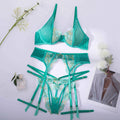 Women's light green polyester embroidered bra set with three-point tights on white background