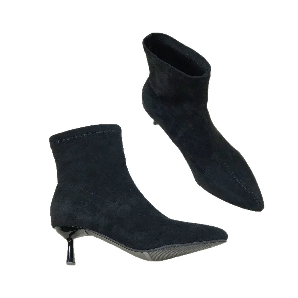 Black pointed toe ankle boots with a stiletto heel on a white background
