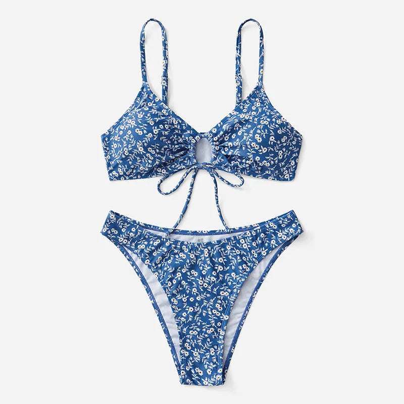 Blue three-piece women's swimsuit set with separate top and shorts on a mannequin.