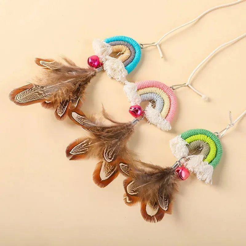 Blue feather rope cat toy hanging from door on elastic cord with adhesive clamp