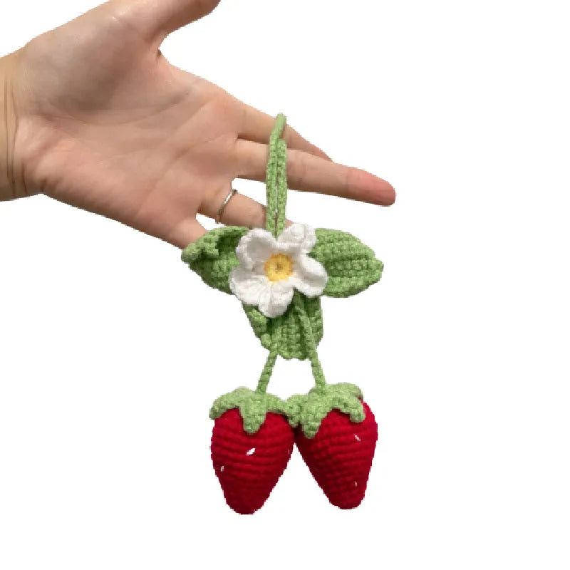 Handmade strawberry-shaped car weaving pendant made from cotton and hemp fibres.