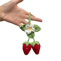 Handmade strawberry-shaped car weaving pendant made from cotton and hemp fibres.