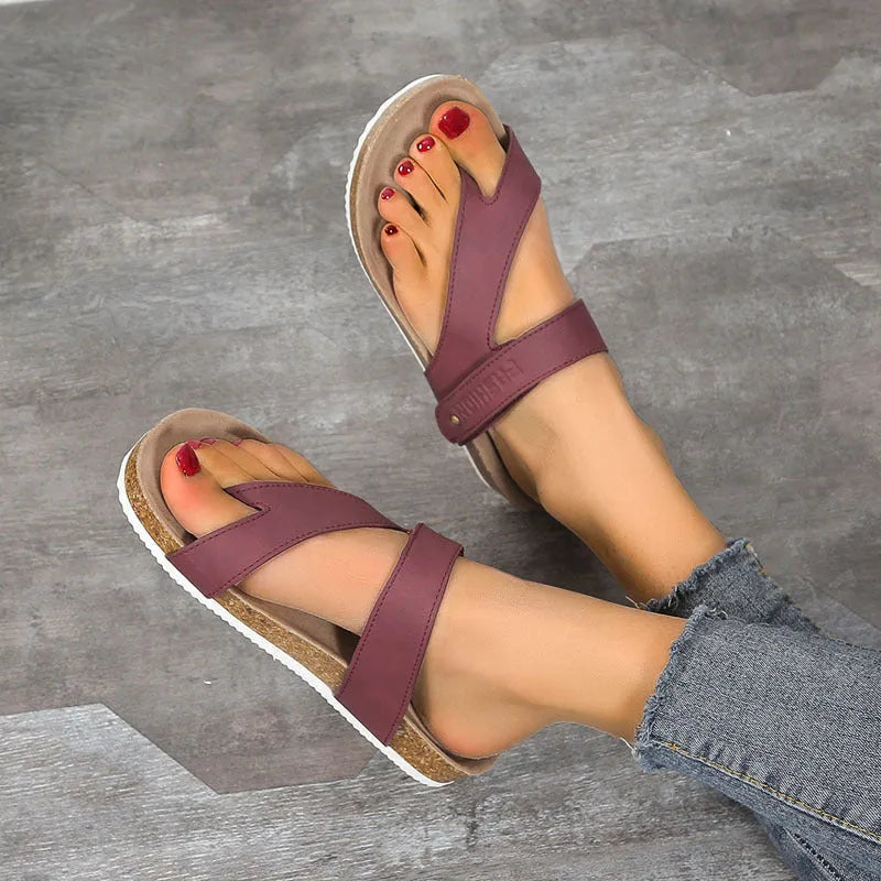 Flat toe ring flip-flops with thick foam sole in blue, shown from the side.