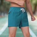 Men's black polyester fitness shorts with high waist and drawstring closure for training