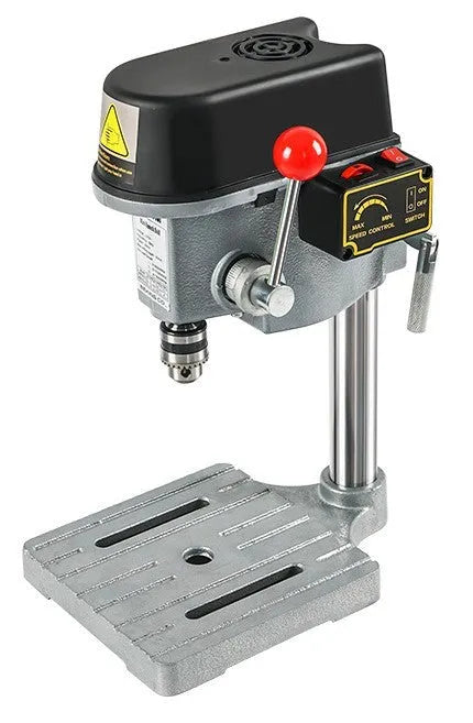 Bench drill and milling machine with cross bench pliers on workbench