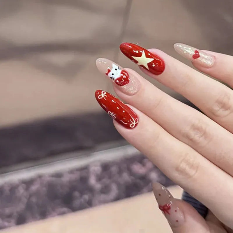 Set of short, colourful fake nails for girls with adhesive tabs on a pink background.