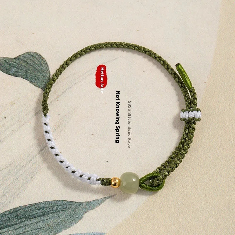 Chinese bracelet with Hetian Jade bead, sterling silver fittings, and adjustable coloured cord strap