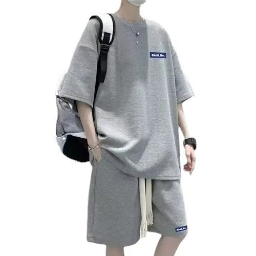 Waffle textured short sleeve top and matching shorts leisure sports suit laid flat.